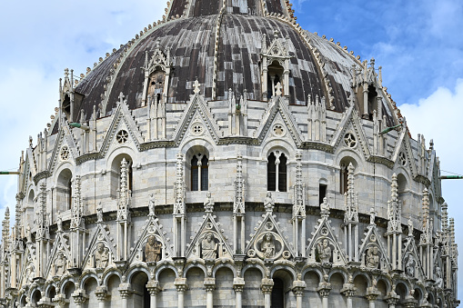 Close-up view of Pisa Baptistery (Pisa Baptistery of St. John) at Piazza dei Miracoli located in Tuscany, Italy, Europe
