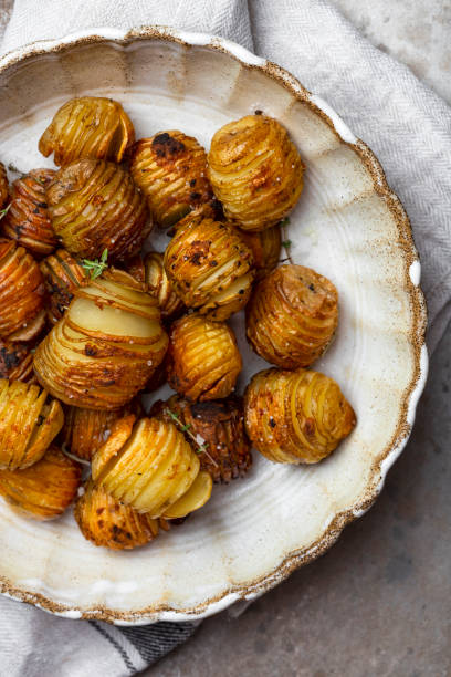 istock baked potatoes with thyme, rosemary and garlic 1339823951