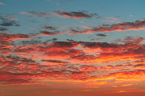 Colorful clouds in dramatic sunset sky