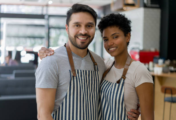 istock Wait staff looking happy working at a cafe 1339827212