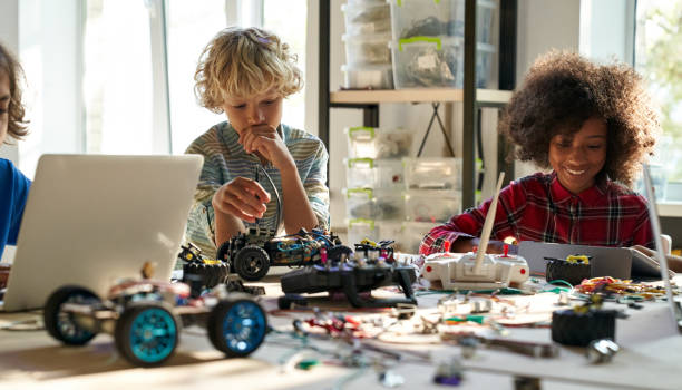 istock Group of diverse schoolkids on STEM science engineering educational class. 1339828620