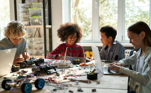 istock Classroom for group of multiracial schoolkids on science engineer education. 1339828646