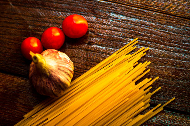 Fresh organic cherry tomatoes with garlic and pasta