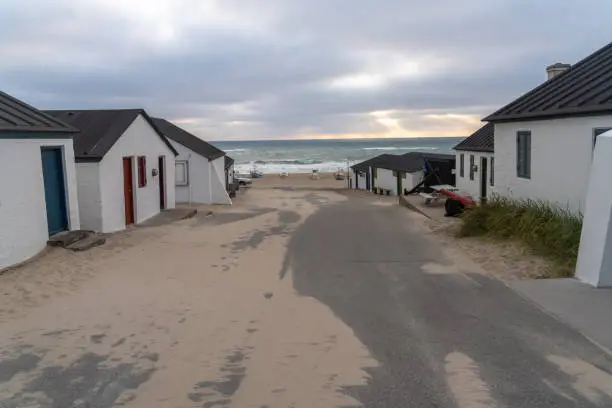 Photo of Stenbjerg Landingsplads, a small idyllic fishing village on a beach and between the high dunes, Thy National Park, Northwest Jutland, Denmark