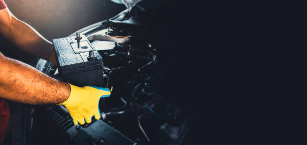 istock Technician replaced new battery of the car 1339834624