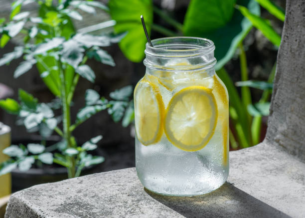 istock Close up of  drinking water with fresh lemon 1339834781