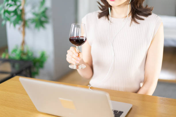 istock A young woman participating in an online drinking party 1339835521