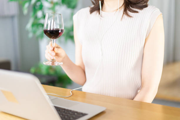 istock A young woman participating in an online drinking party 1339835538