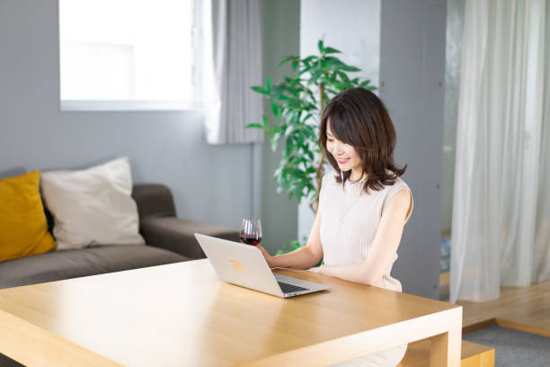 istock A young woman participating in an online drinking party 1339835539