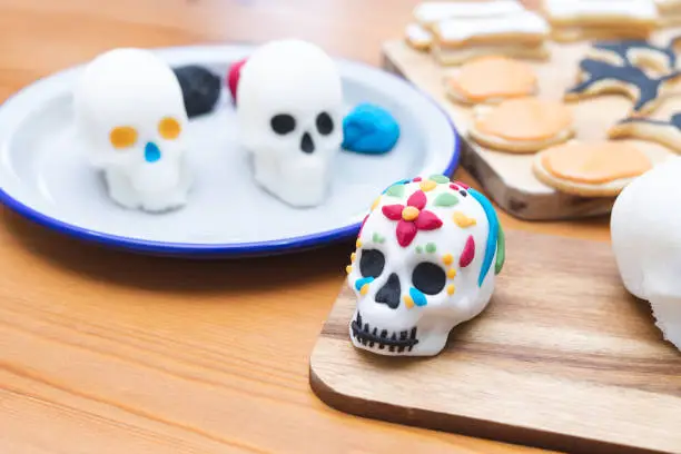 Photo of Day of the Dead. Decoration process of skulls for the Day of the Dead. Copy space. Mexican party.