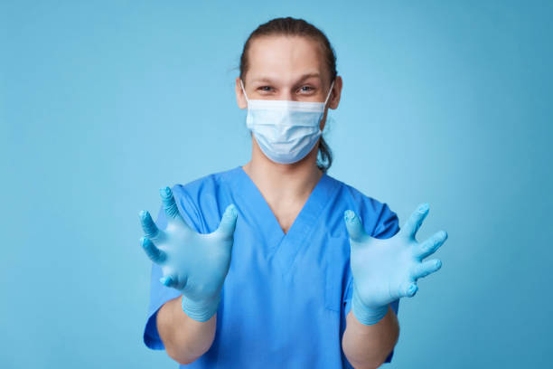 istock Doctor mammologist touching virtual patient breast on blue background. 1339840272