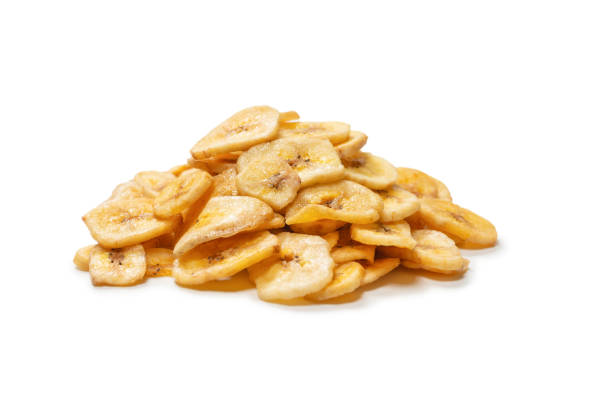 istock Banana chips isolated on a white background. Dehydrated banana. 1339841634
