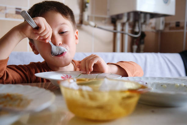 istock 4-5 years old cute child eating food 1339841665