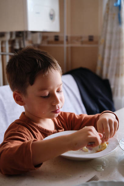istock 4-5 years old cute child eating food 1339841762