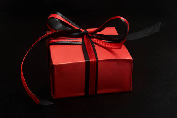 istock Black friday sale concept with gift box with ribbon 1339844401