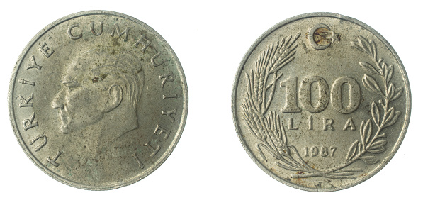 Turkey 100 lira coin on a white isolated background