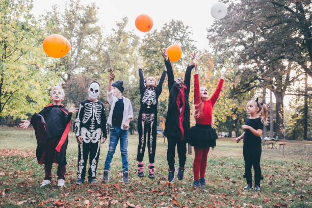 istock Halloween Masked Kids In The Park 1339845049