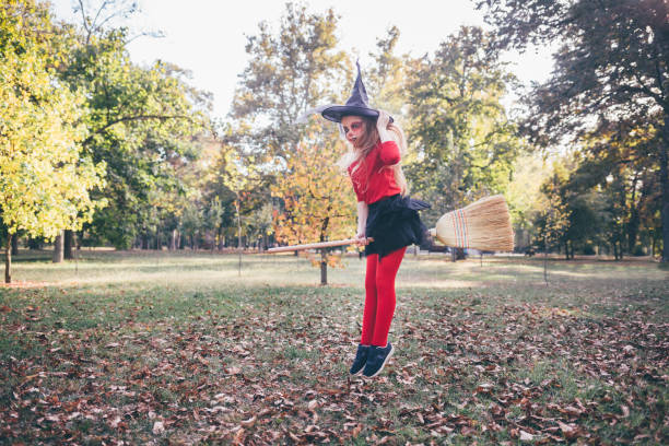 istock Halloween Masked Witch Flies On A Broom 1339846255