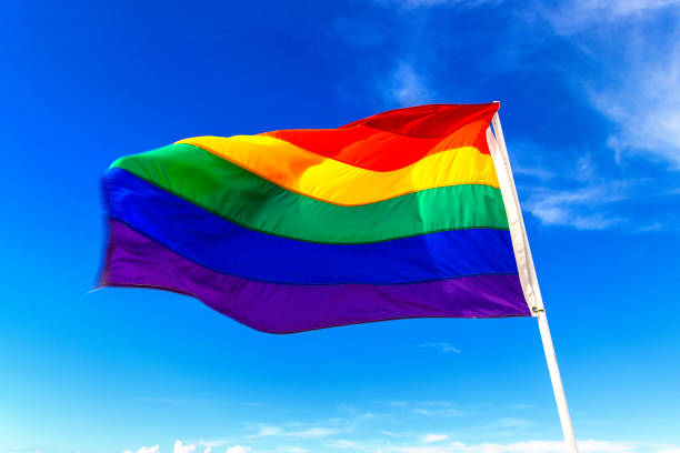 istock Rainbow LGBT gay flag against sky 1339847504