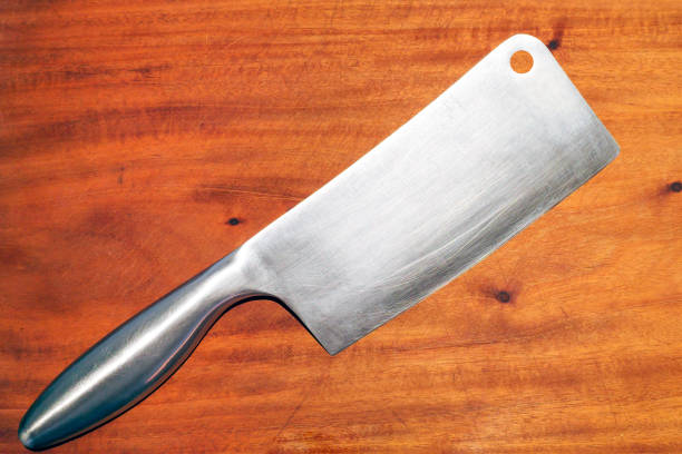 Cleaver knife on dark black slate  background. Top view.