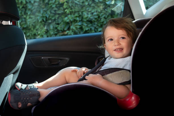istock Cute toddler sleeping in car safety seat while traveling 1339854556