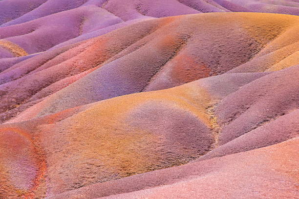Earth of seven colors, Chamarel, Mauritius. Natural background from multi-colored sand. Selective focus