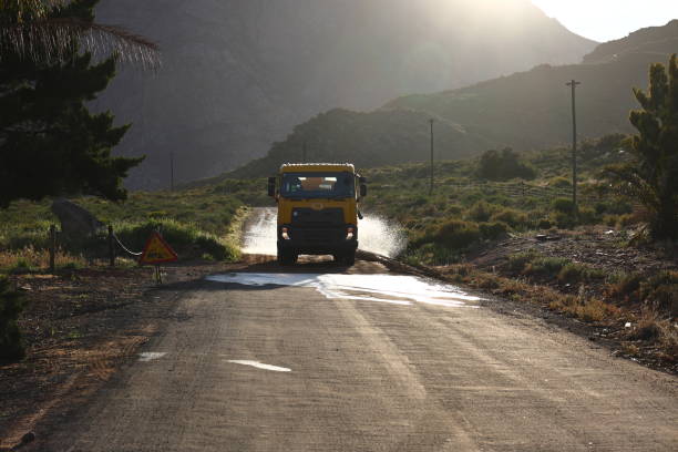 istock A lorry spraying water on a dirt road 1339856765