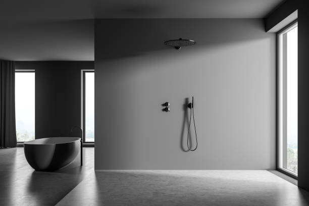istock Spacious dark grey shower room with panoramic windows and a bathtub 1339860555