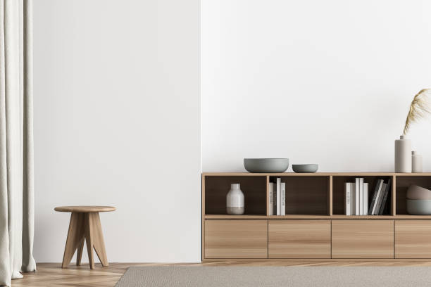 istock Minimalist light beige living room with stool 1339860682