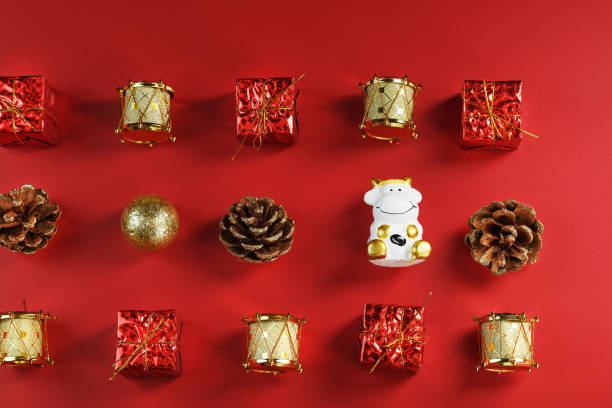 istock Christmas decorations and toys with a cow on a red background. 1339865835