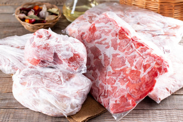 istock Frozen meat in a plastic bag on a table. Frozen food. 1339872842