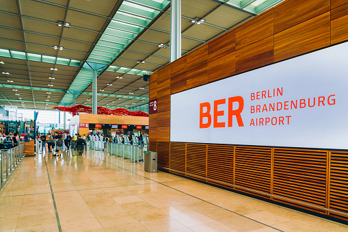 Berlin, Germany - July 26, 2021:  Sign and Check-in hall of the new Berlin Brandenburg Airport, Terminal 1 in Germany.