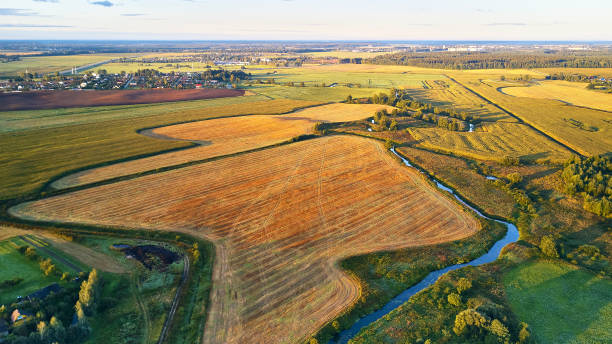 istock September agriculture fields aerial panorama. Sunny autumn landscape. Corn harvest. 1339876558