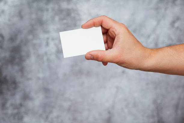 istock Human hand holding a blank card 1339878010