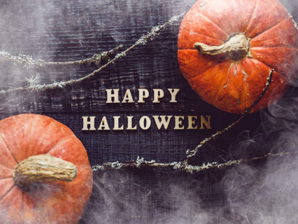 istock Happy Halloween. Pumpkins lying on the table 1339878055