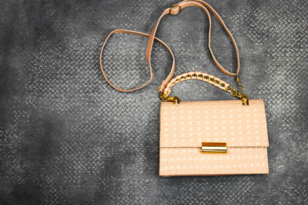 istock light salmon braided leather  shoulder bag isolated on grey grunge background 1339879301