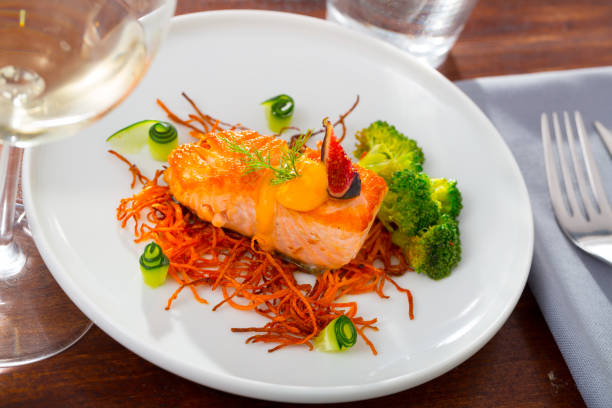 Fried salmon with smoked julienne carrot, broccoli, cucumber, figs