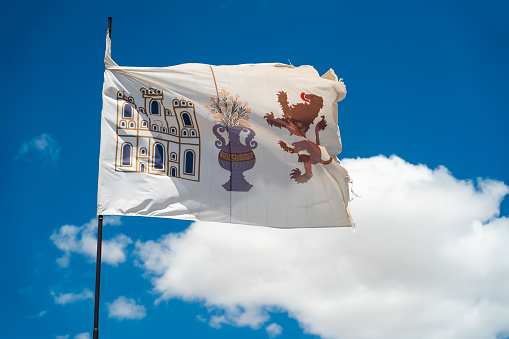 Two Mexico's flag on a blue sky, sunny day