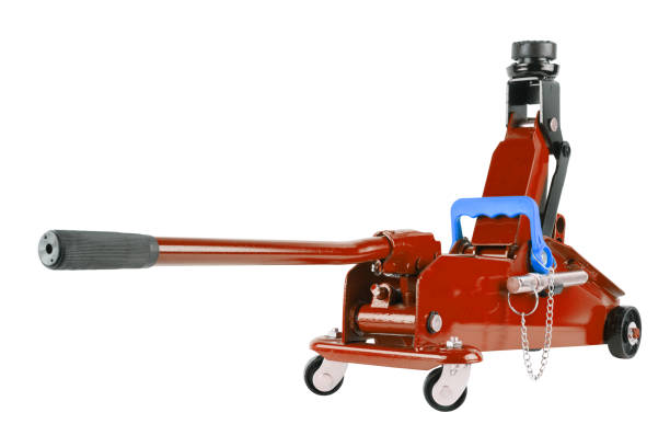 istock red hydraulic car jack isolated on white background, rised up 1339880258