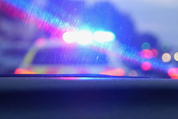 istock View of blurred police car light through car windscreen 1339884986