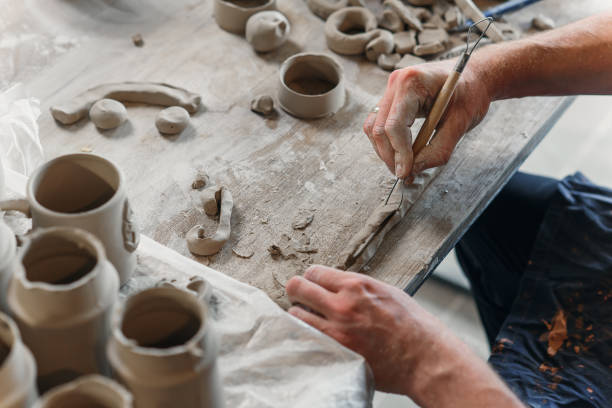 istock Male potter hands working with clay. Art work concept. 1339885065
