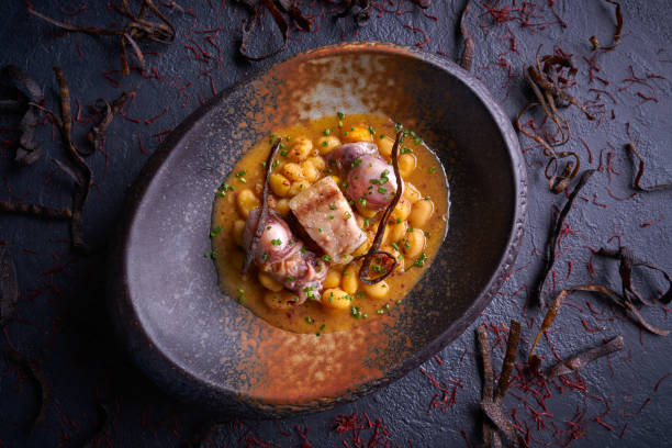 istock Judias pochas beans with calamari 1339885471