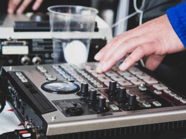 istock making hip hop beats on a drum machine controller and turntables in a home studio 1339886776