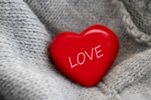 red heart sweater fabric background scarf