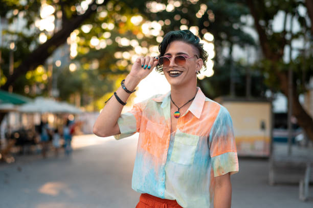 Gay man smiling outdoors