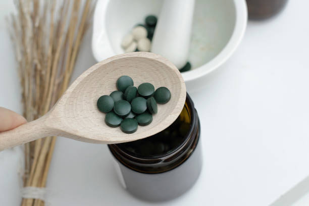 istock Mortar with spirulina pills 1339896168