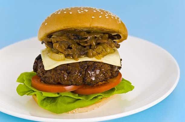 istock Classic Hamburger with cheese tomato salad and roasted onions 133989790