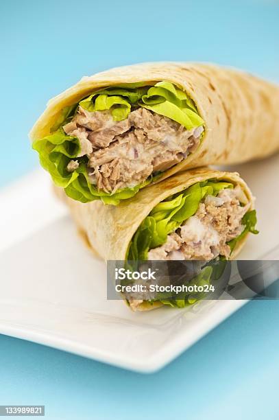 Two Tuna Melt Wrap On A White Plate Stock Photo - Download Image Now - Tuna - Seafood, Wrap Sandwich, Breakfast