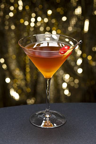 istock Manhattan cocktail garnished with a cherry and lemon 133989922