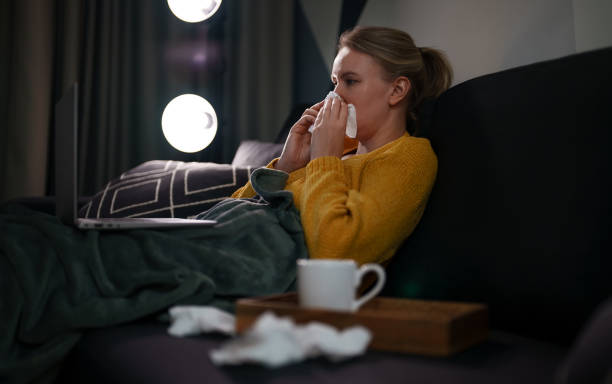 istock Sick woman trying to work from home. 1339899706